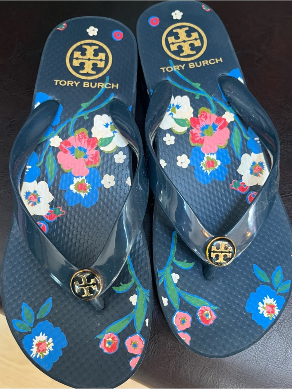 Tory Burch Navy Floral Logo Jelly Flip Flops with Gold Emblem